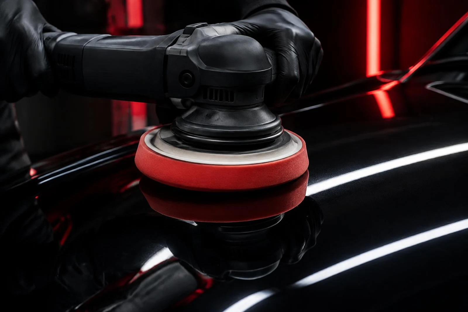 Buffer polishing automotive clear coat to a gloss